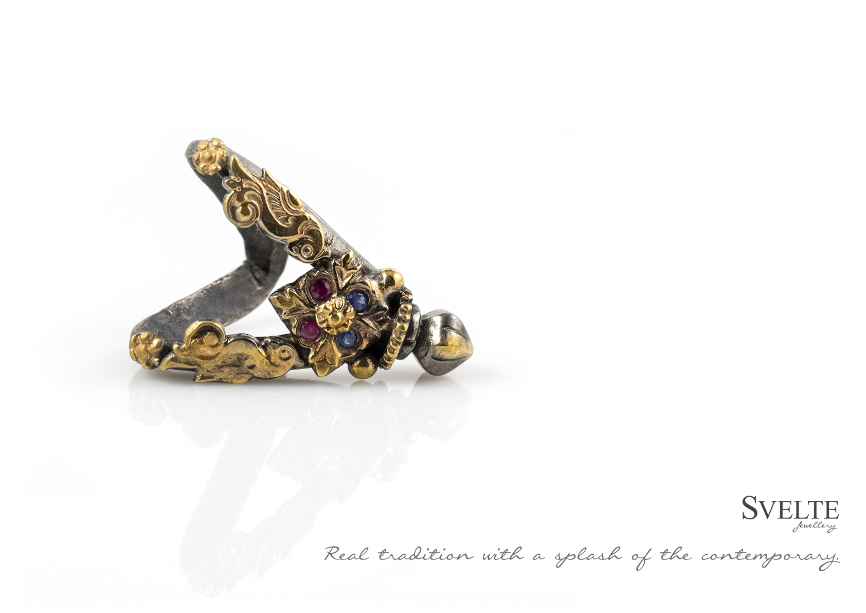 ANTIQUE V SHAPED RING WITH ADDED BLUE SAPPHIRES AND RUBIES